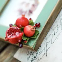 Гранаты: лепка броши и сережек