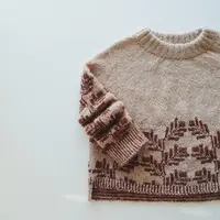 Пуловер с жаккардом по низу тела и рукавам спицами Hvila